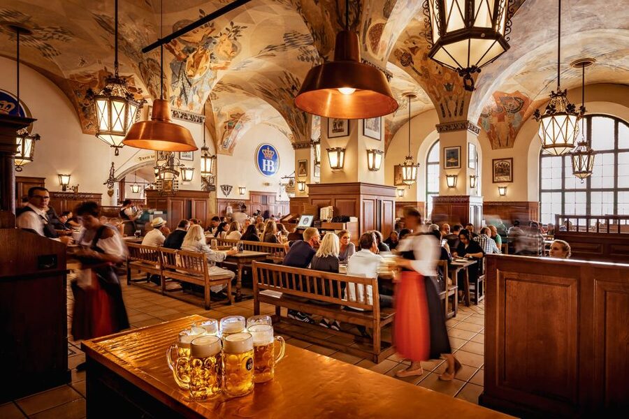 Munich: Hofbräuhaus Guided Tour with 1 Beer - Inside Hofbräuhaus: huge rooms, Bavarian style, and memorable stories
