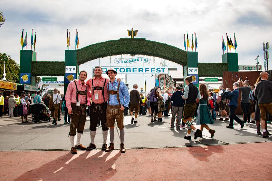 Munich: Oktoberfest Tour with Tent Reservation, Food & Beer - Inside the beer tent: reserved seats, songs, and your included half chicken